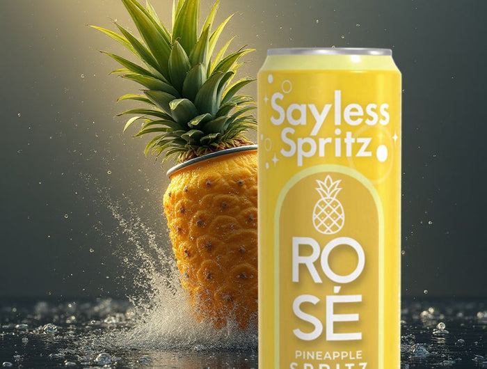 <h5><span style="text-decoration:underline">MEET OUR FAN FAVORITE!</span></h5><h2>SAYLESS SPRITZ® <em>Pineapple Rosé Spritz</em></h2><p>Welcome to the refreshing and exotic world of Sayless Spritz’s Pineapple Rosé Spritz. This delightful beverage is designed to bring a taste of tropical paradise to your everyday moments. Perfectly crafted to offer a blend of sophistication and refreshment, our Pineapple Rosé Spritz is ideal for any occasion. Whether you're lounging by the pool, hosting a summer barbecue, or simply enjoying a quiet evening at home, this spritz promises to elevate your drinking experience.</p><p>Pineapple Rosé Spritz is a tantalizing blend of premium rosé wine, sparkling water, and natural pineapple flavor. This spritz offers a unique combination of sweet and tangy notes, creating a refreshing and invigorating drink that is perfect for hot summer days and nights.</p>